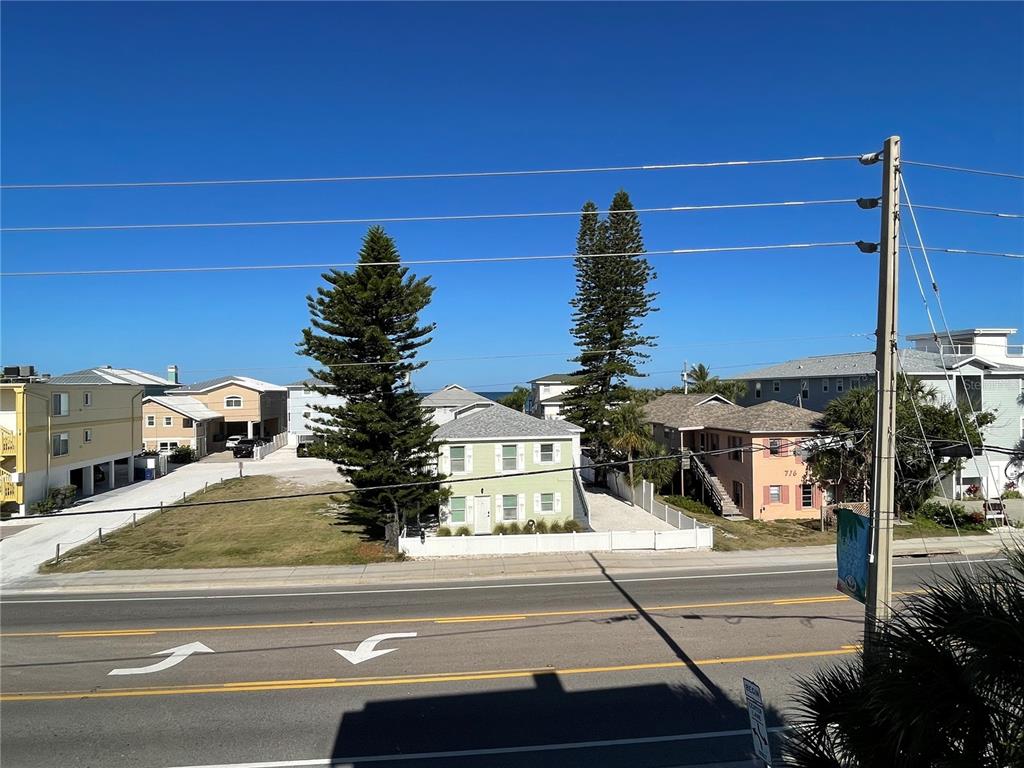 711 Gulf Boulevard Indian Rocks Beach, FL 33785 - Photo 11 of 19 a view of a building with a yard