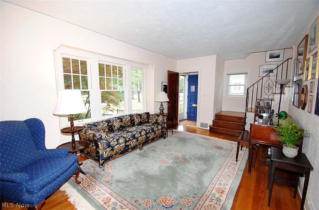 3300 Avalon Road Cleveland, OH 44120 - Photo 2 of 25 LARGE AND INVITING LIVING ROOM WITH WOOD FLOORING AND LARGE WINDOWS
