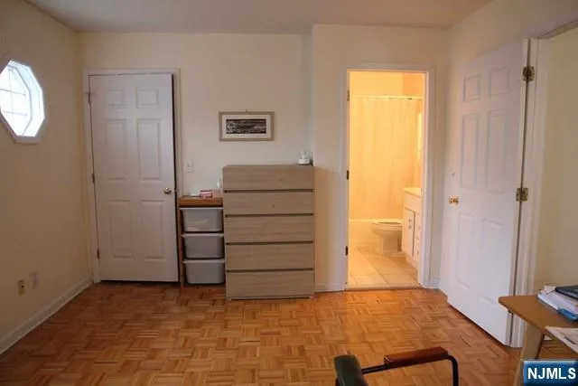 a view of room with wooden floor