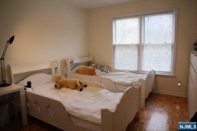 a bedroom with bed and window