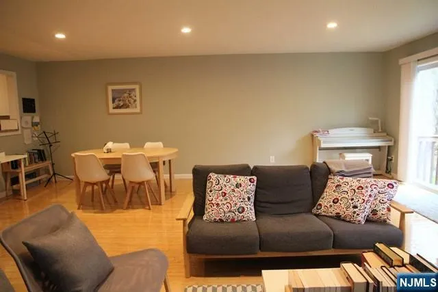 a living room with furniture and a table