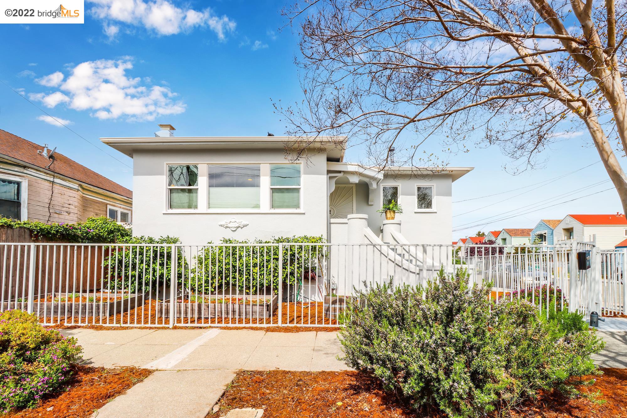 1427 Campbell Street Oakland, CA 94607 - Photo 1 of 1 a view of a house with a small yard and plants