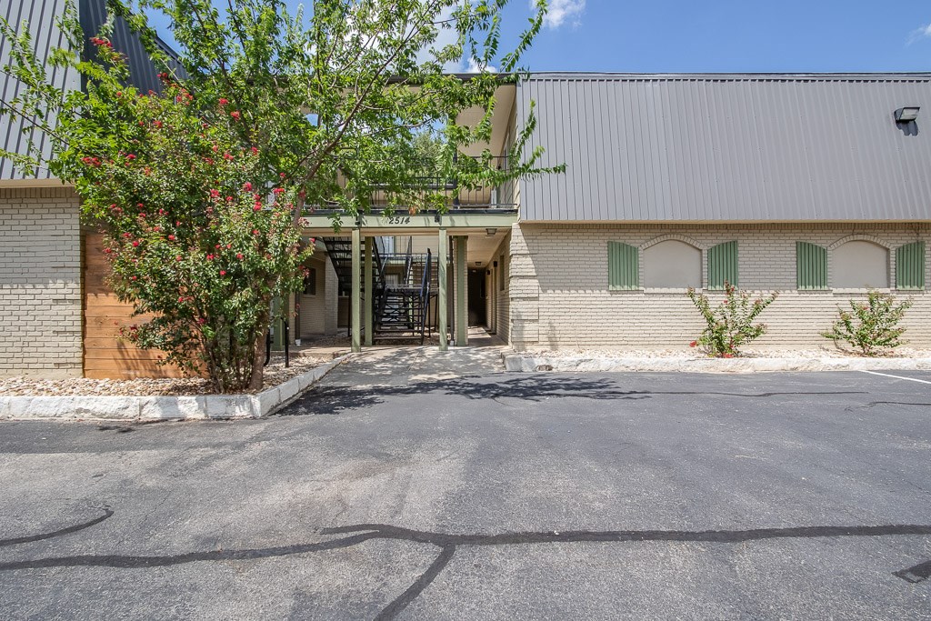 2514 Thornton Road, Unit 12 Austin, TX 78704 - Photo 1 of 1 a front view of a house with a yard and garage