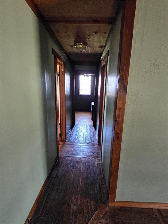 608 Ripley Street Coleman, TX 76834 - Photo 13 of 23 a view of a hallway with wooden floor