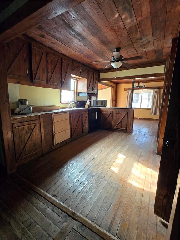 608 Ripley Street Coleman, TX 76834 - Photo 4 of 23 a view of a room with wooden floors and furniture