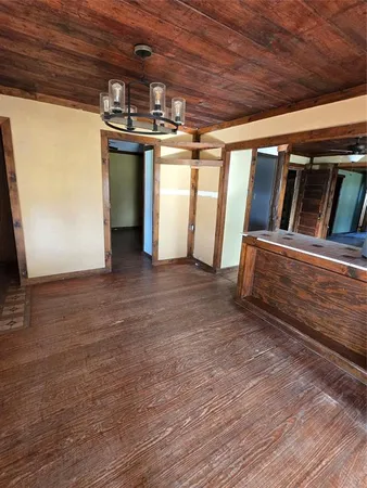 a view of an empty room with windows