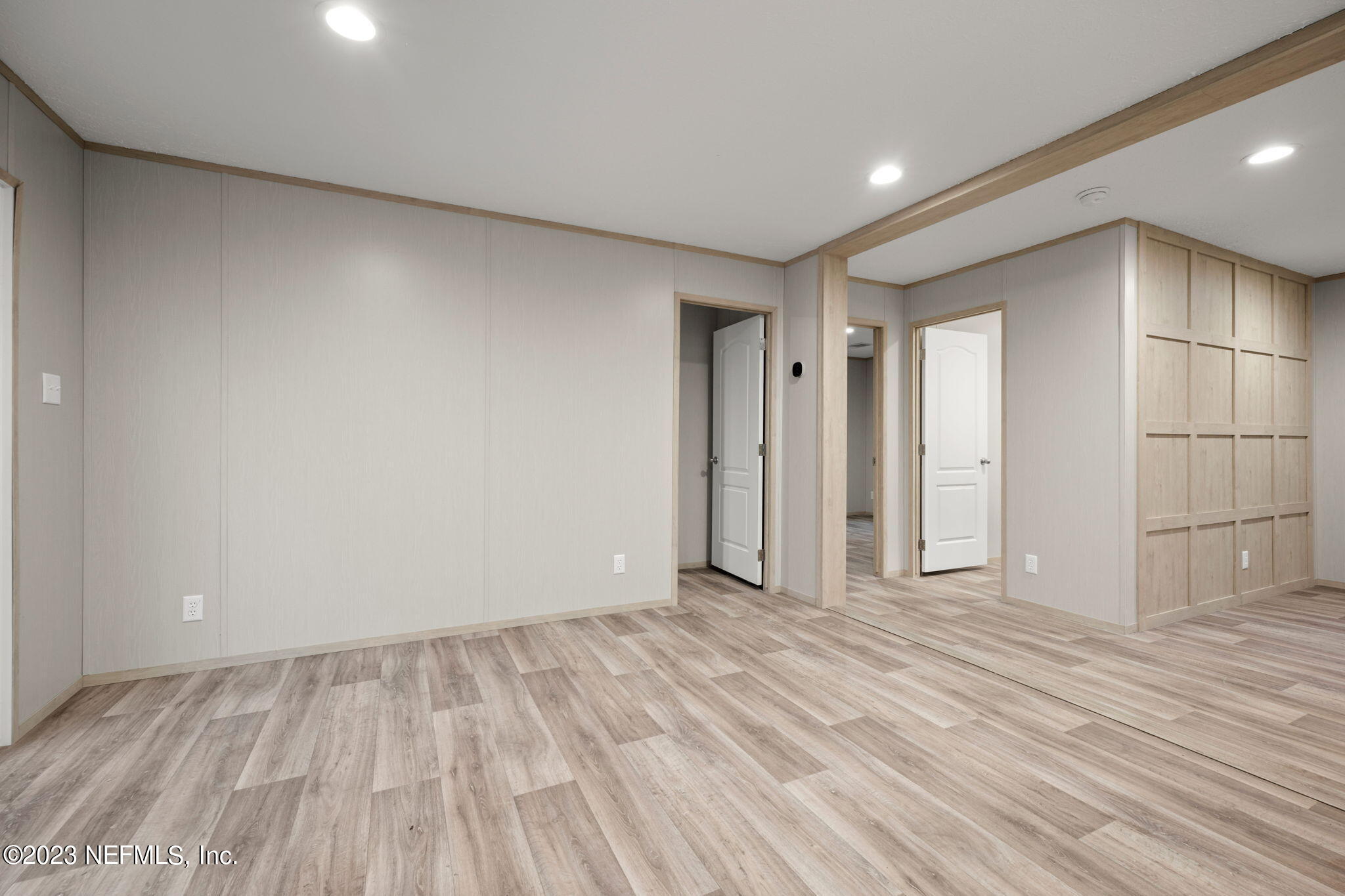 1100 Mulberry Landing Road Hilliard, FL 32046 - Photo 13 of 32 a view of an empty room and wooden floor