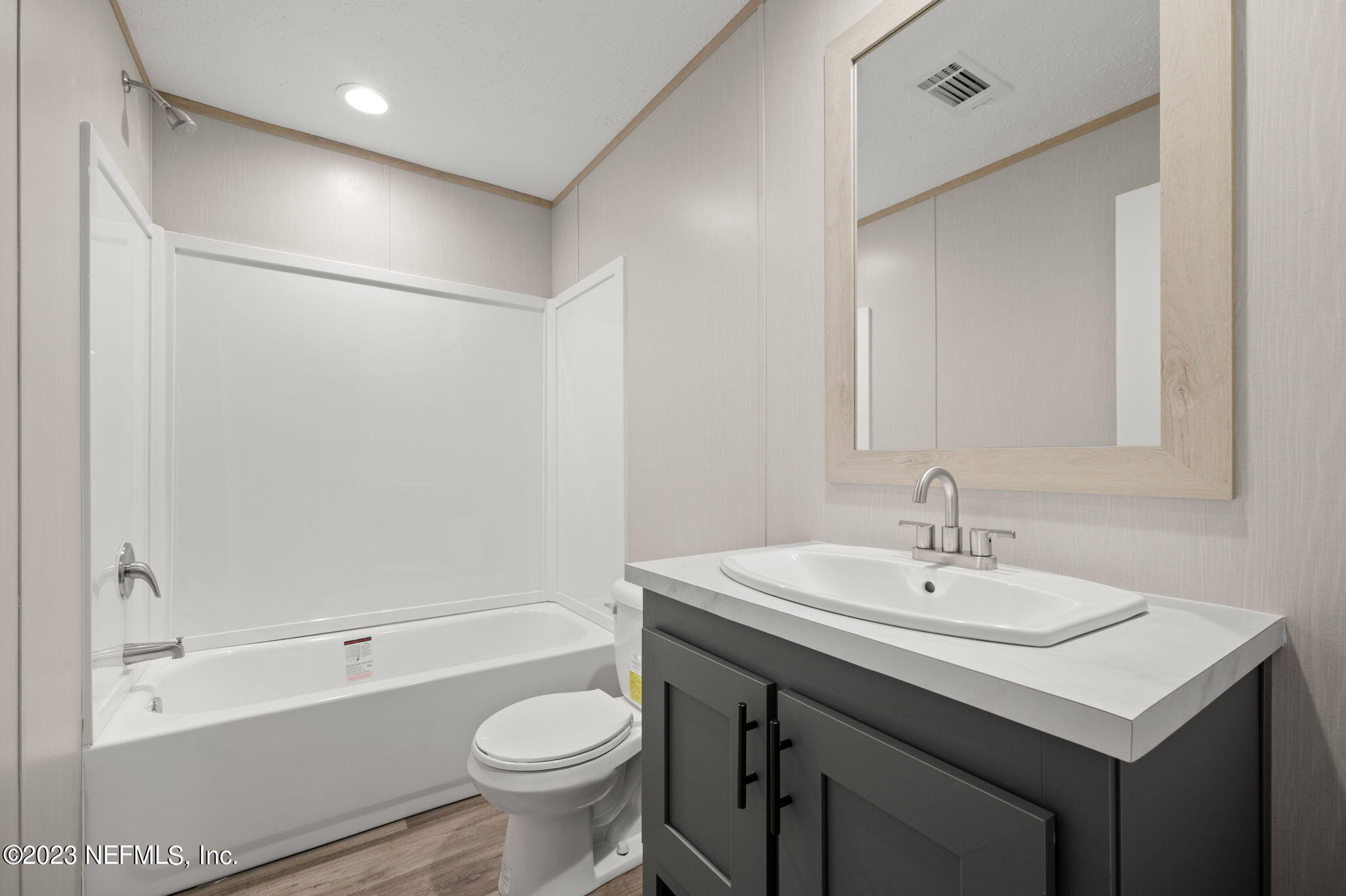 1100 Mulberry Landing Road Hilliard, FL 32046 - Photo 15 of 32 a bathroom with a sink toilet and shower