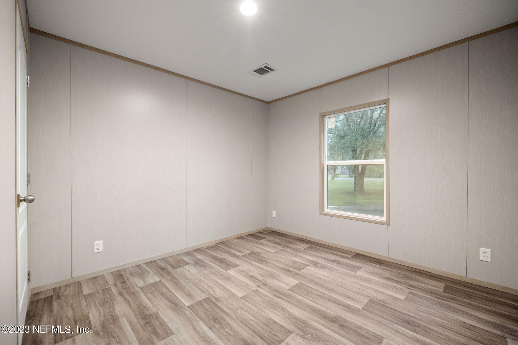 1100 Mulberry Landing Road Hilliard, FL 32046 - Photo 19 of 32 an empty room with windows and closet