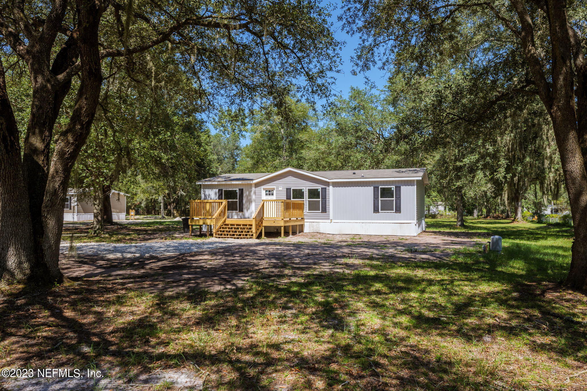 1100 Mulberry Landing Road Hilliard, FL 32046 - Photo 2 of 32 a front view of a house with a yard