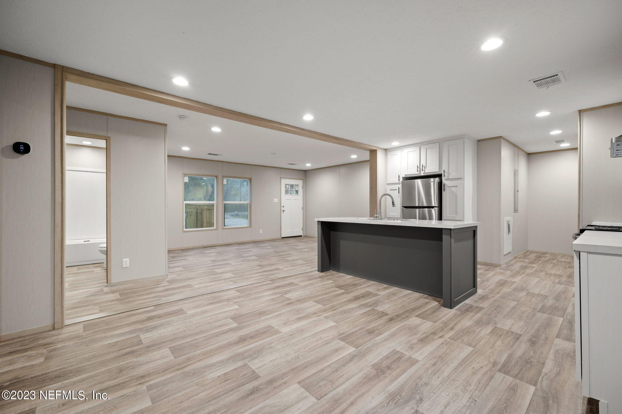1100 Mulberry Landing Road Hilliard, FL 32046 - Photo 21 of 32 a view of kitchen with refrigerator cabinets and wooden floor