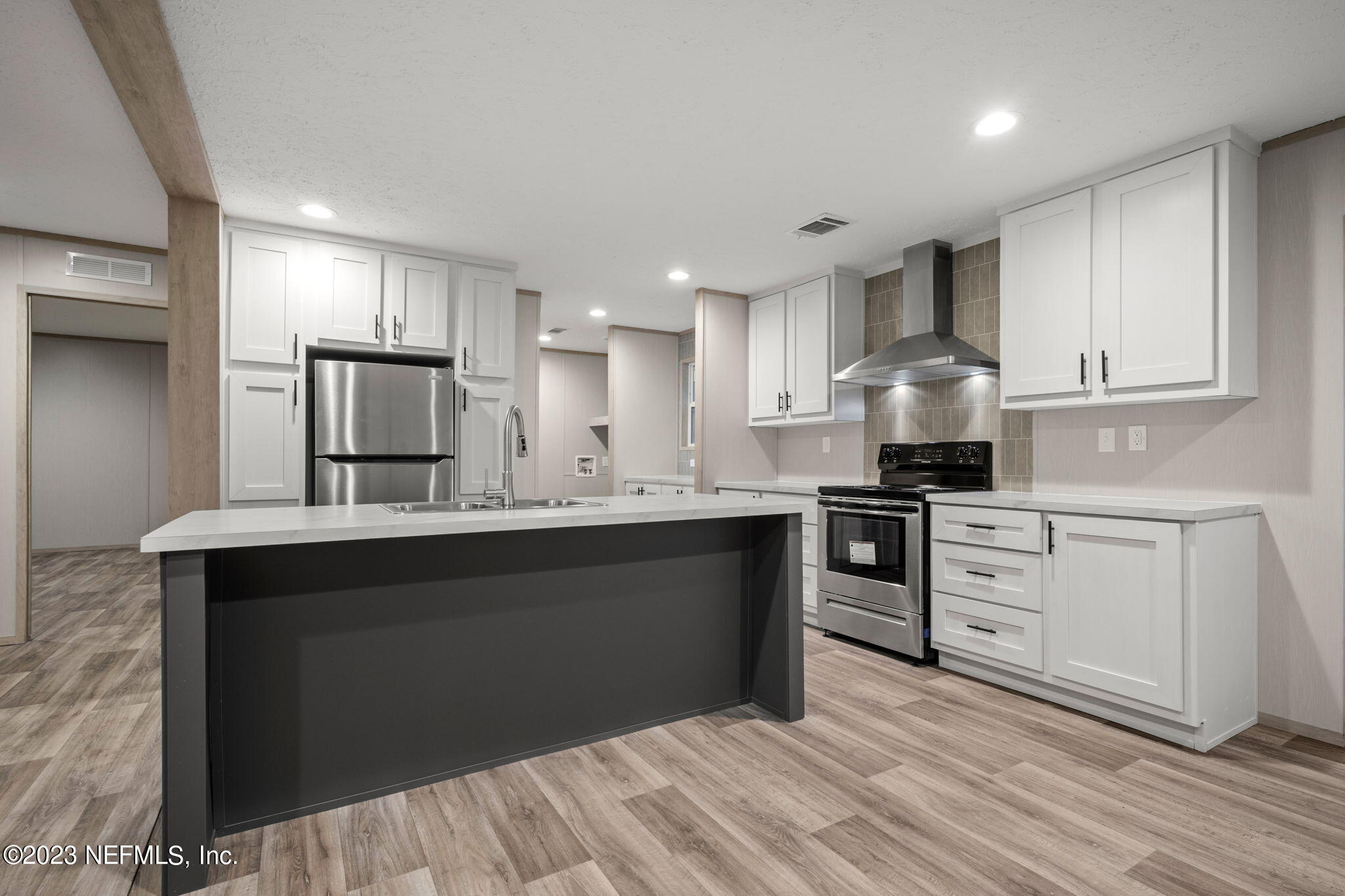 1100 Mulberry Landing Road Hilliard, FL 32046 - Photo 22 of 32 a kitchen with a sink stove and refrigerator