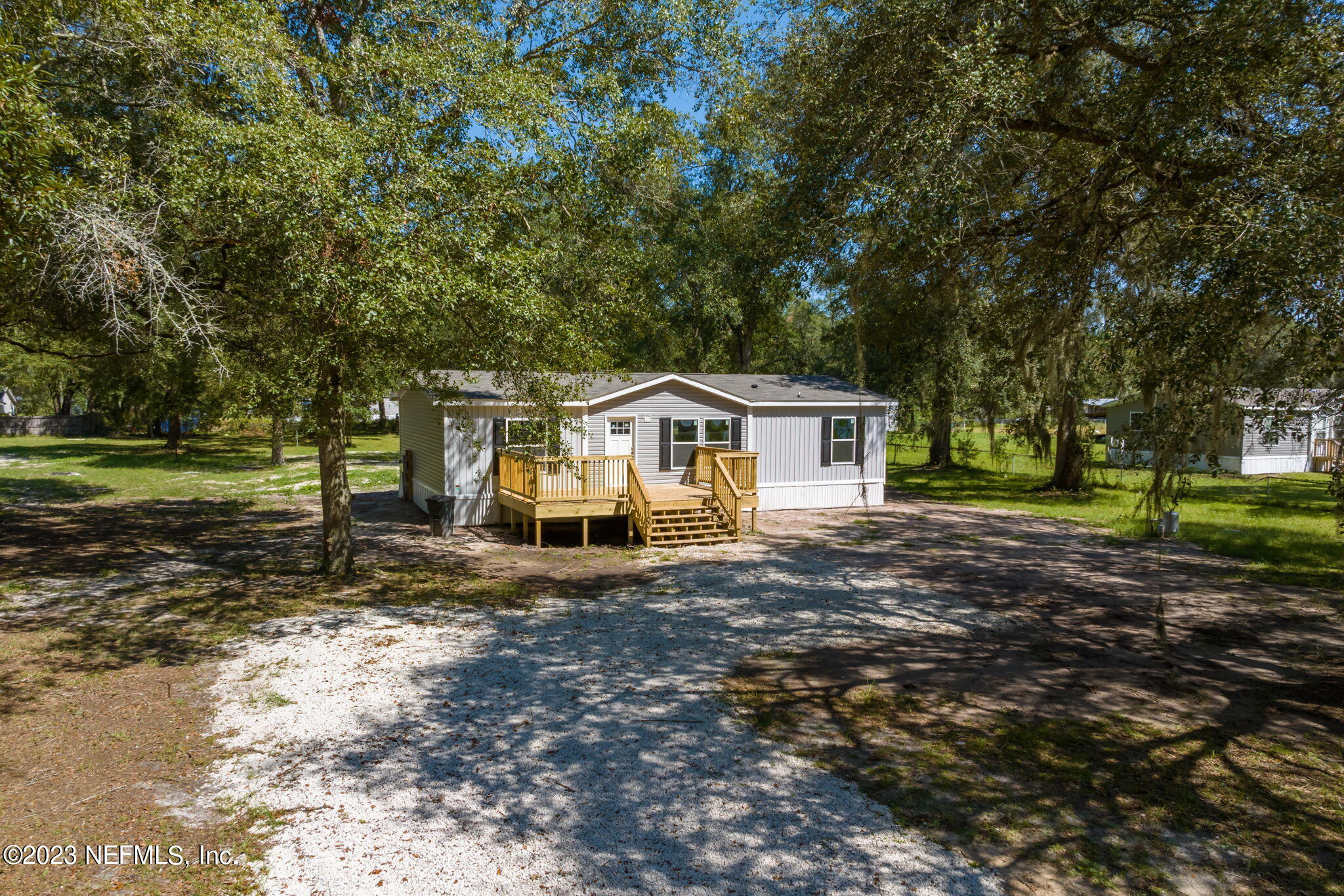 1100 Mulberry Landing Road Hilliard, FL 32046 - Photo 25 of 32 a view of a house with a yard