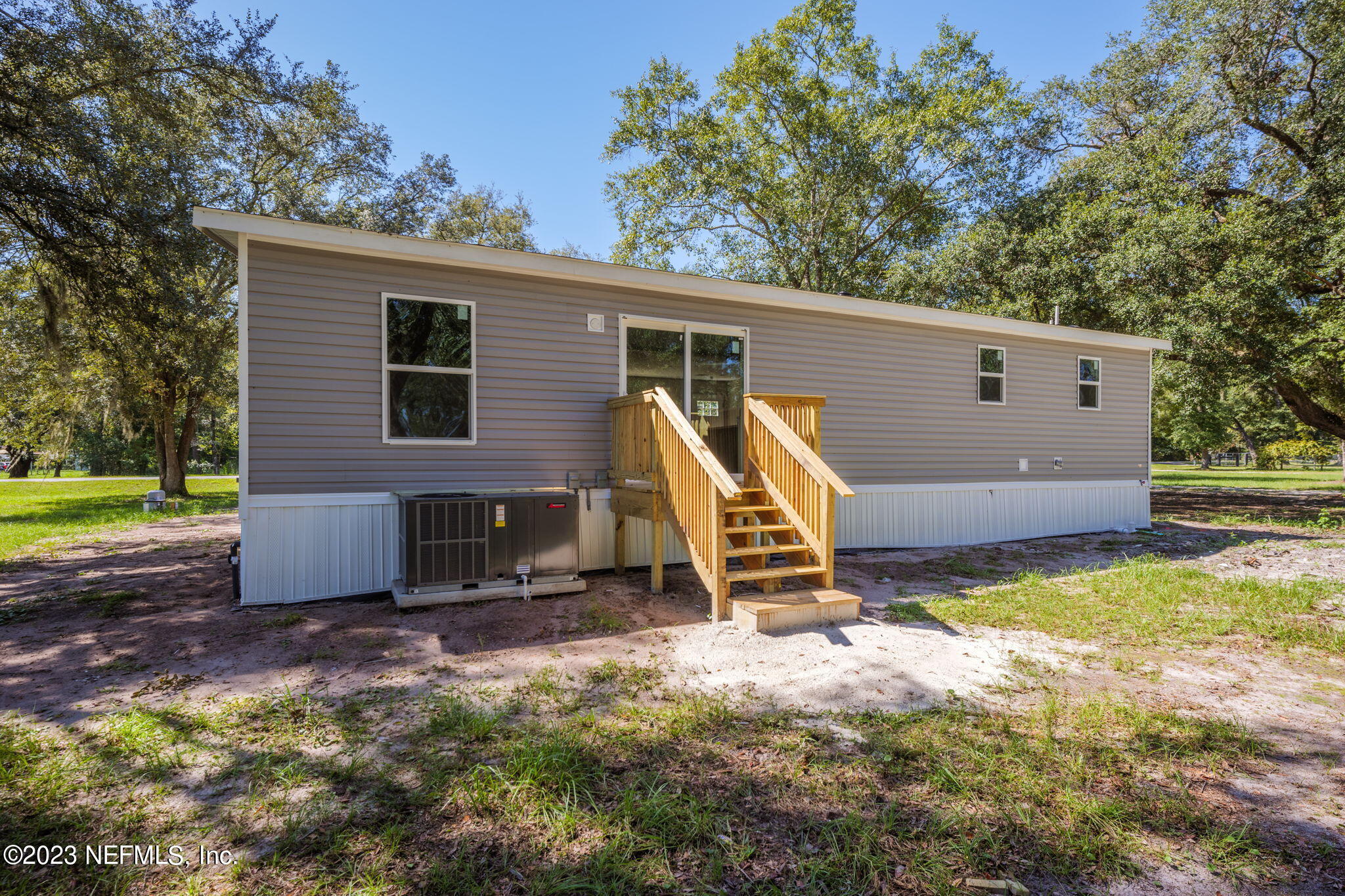 1100 Mulberry Landing Road Hilliard, FL 32046 - Photo 26 of 32 a view of a house with backyard