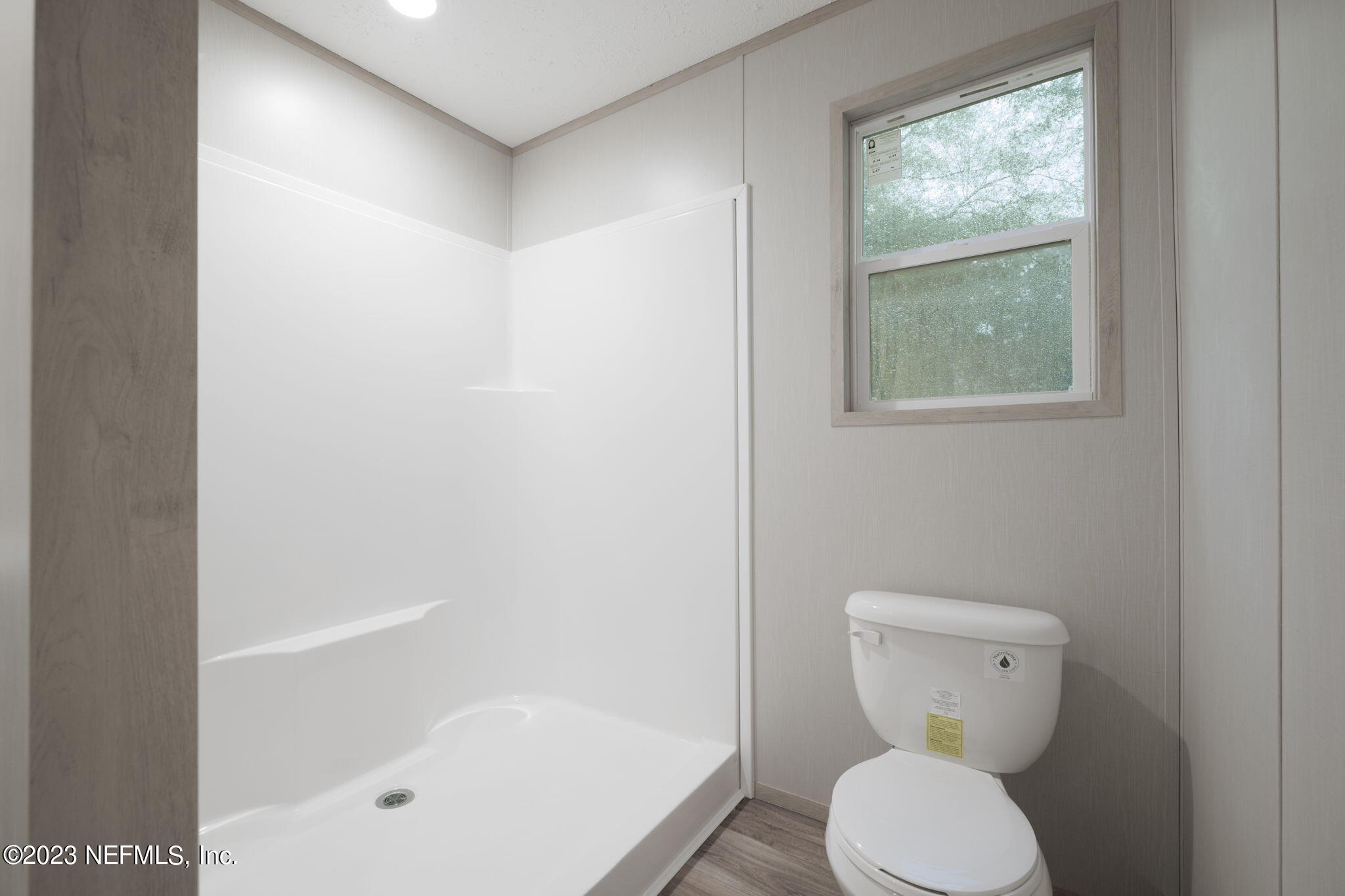 1100 Mulberry Landing Road Hilliard, FL 32046 - Photo 8 of 32 a bathroom with a toilet and a bathtub