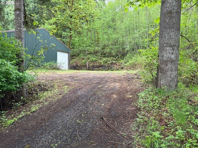 28381 South Salo Road Mulino, OR 97042 - Photo 2 of 6 a view of a yard with plants and large trees