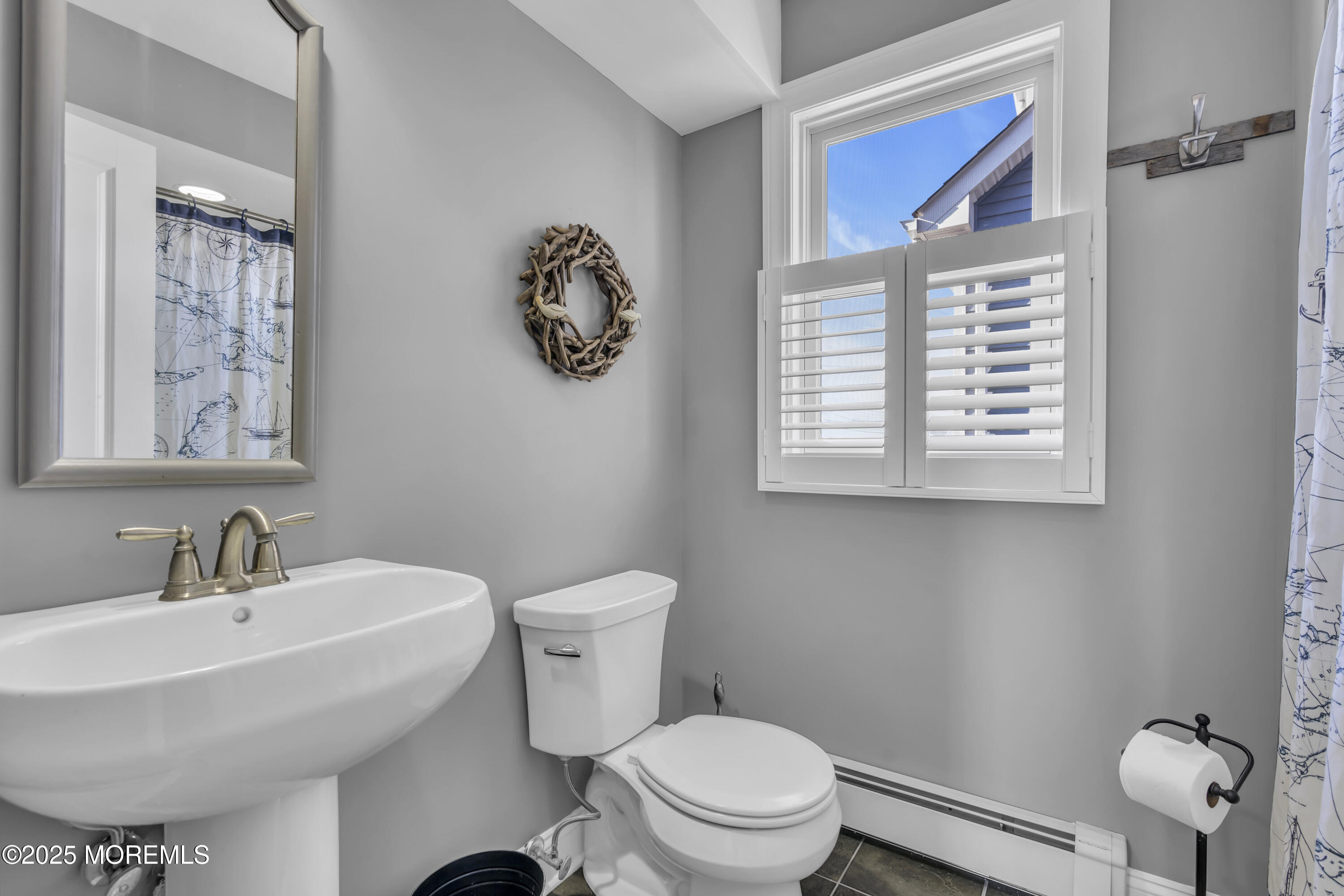 132 St Lawrence Boulevard Brick, NJ 08723 - Photo 22 of 55 a bathroom with a toilet a sink and mirror