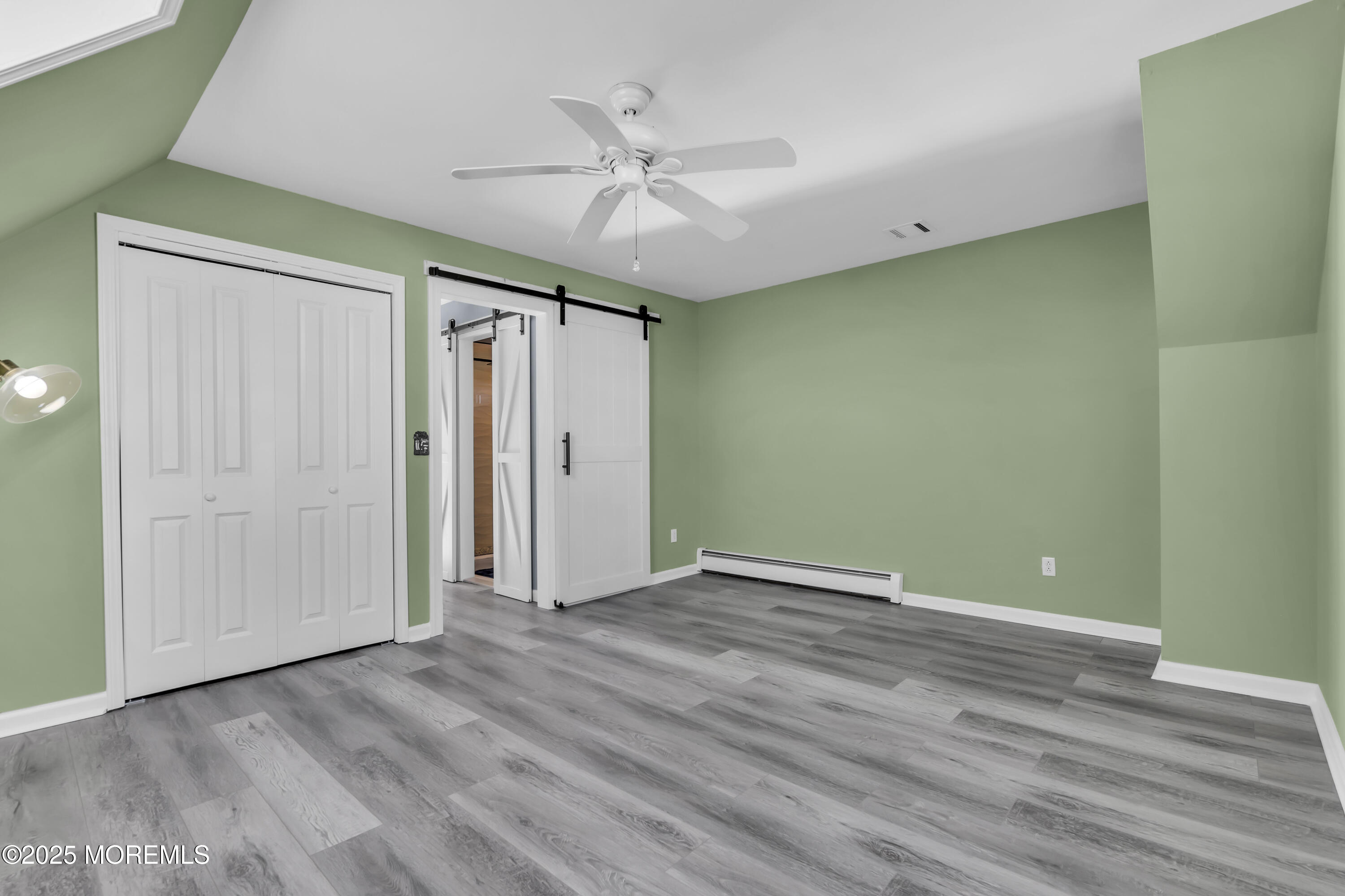 132 St Lawrence Boulevard Brick, NJ 08723 - Photo 24 of 55 an empty room with wooden floor fan and windows
