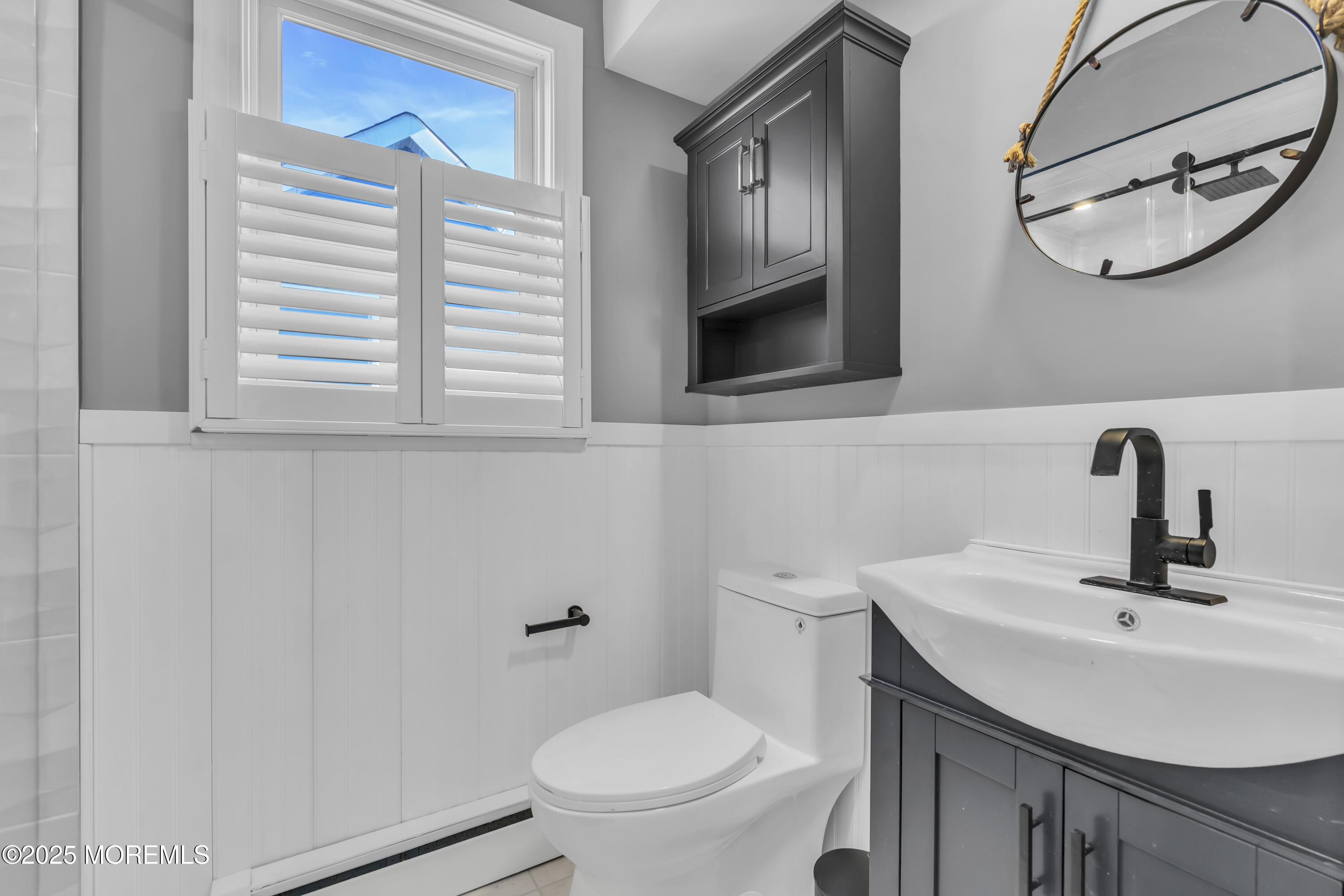 132 St Lawrence Boulevard Brick, NJ 08723 - Photo 28 of 55 a bathroom with a sink a mirror and a toilet