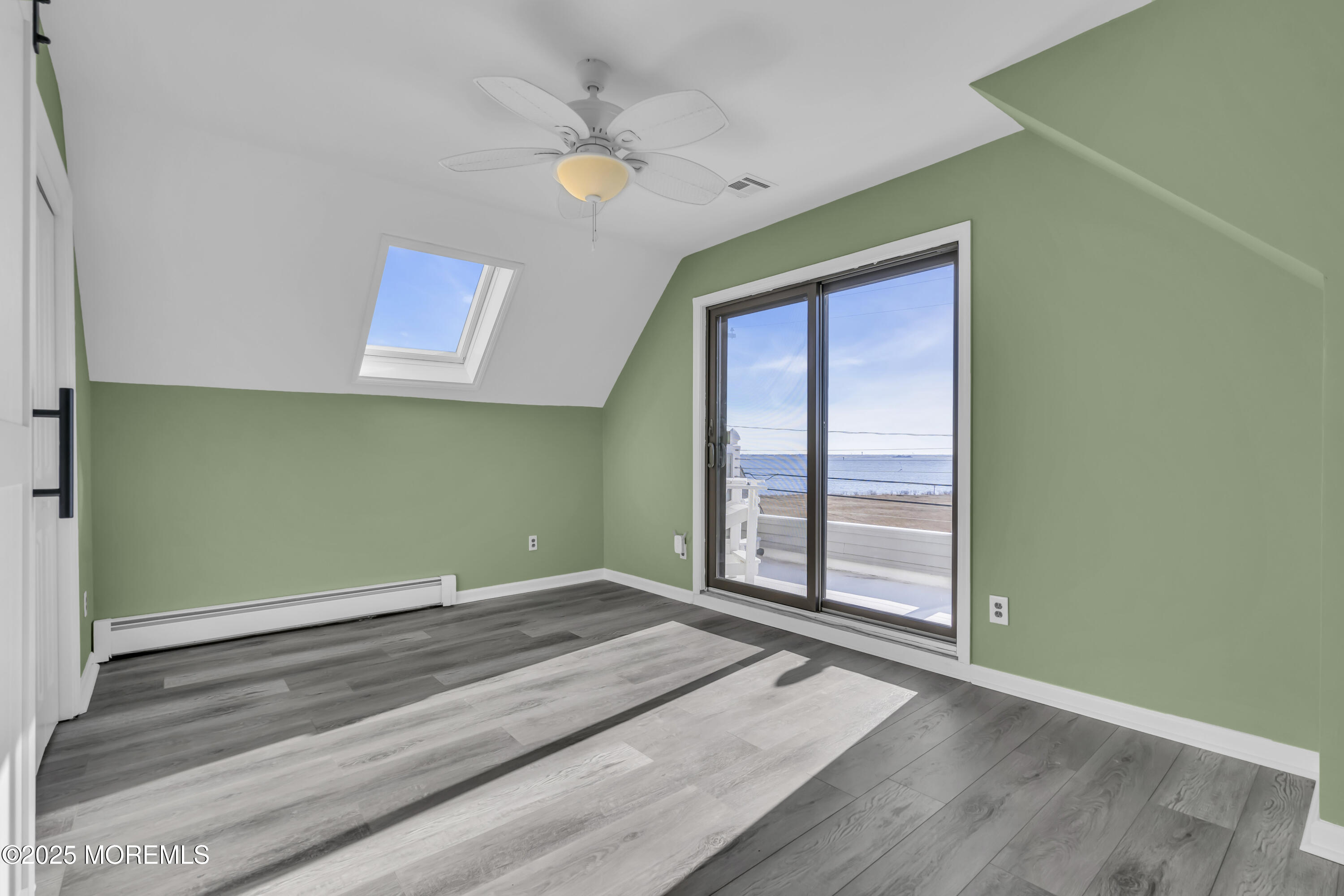 132 St Lawrence Boulevard Brick, NJ 08723 - Photo 33 of 55 an empty room with wooden floor and windows