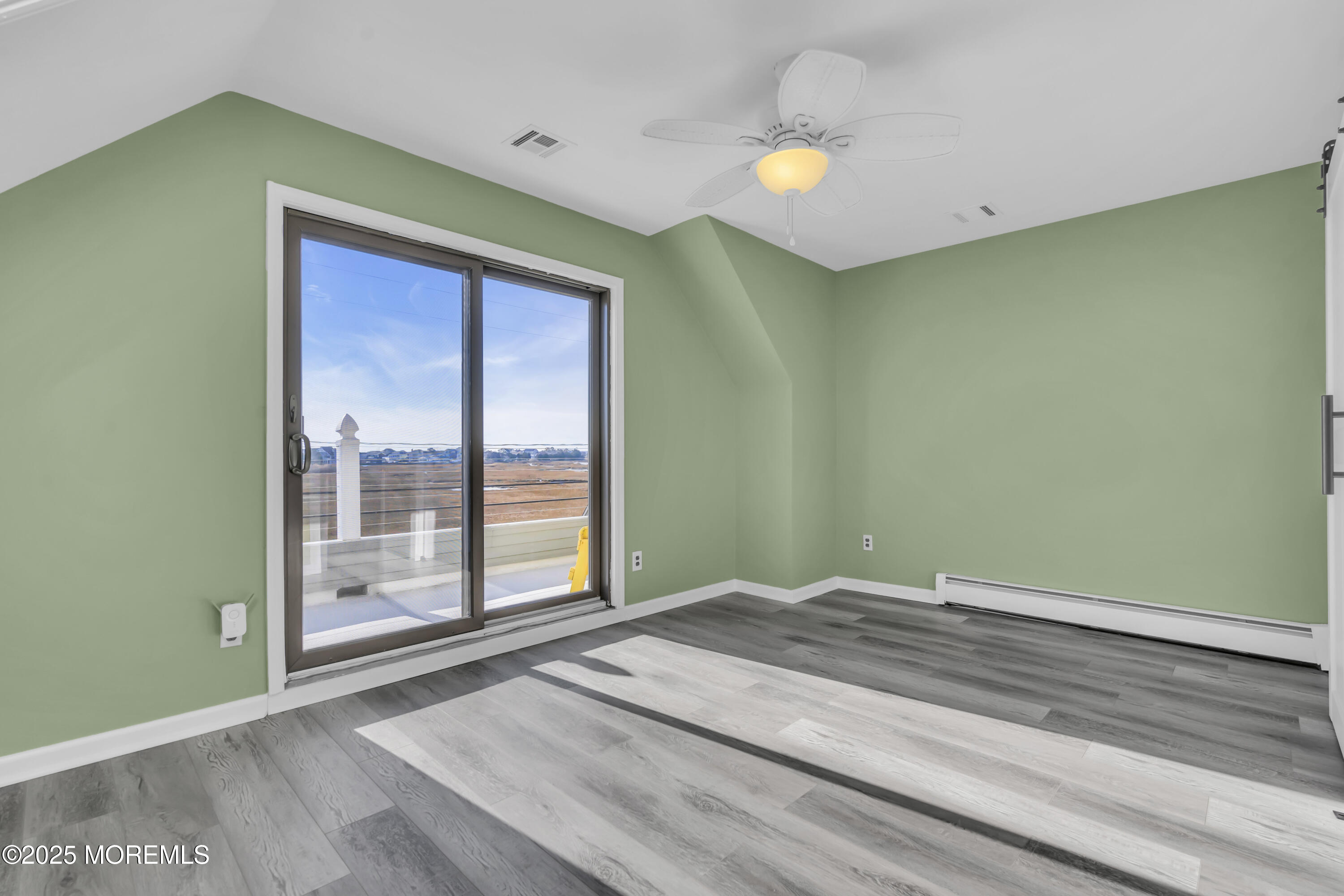 132 St Lawrence Boulevard Brick, NJ 08723 - Photo 34 of 55 a view of a big room with wooden floor and windows
