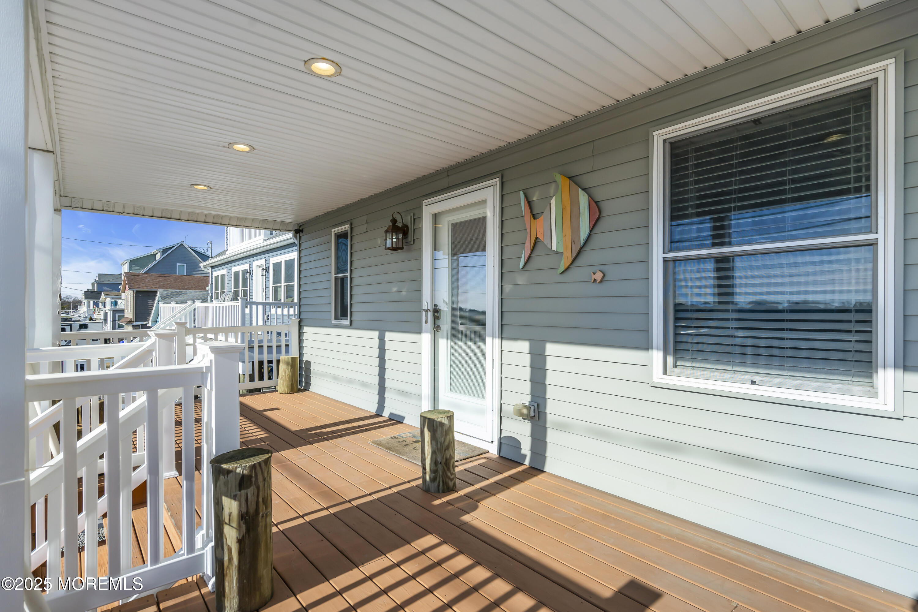 132 St Lawrence Boulevard Brick, NJ 08723 - Photo 41 of 55 a balcony view with a couple of chairs and a wooden floor