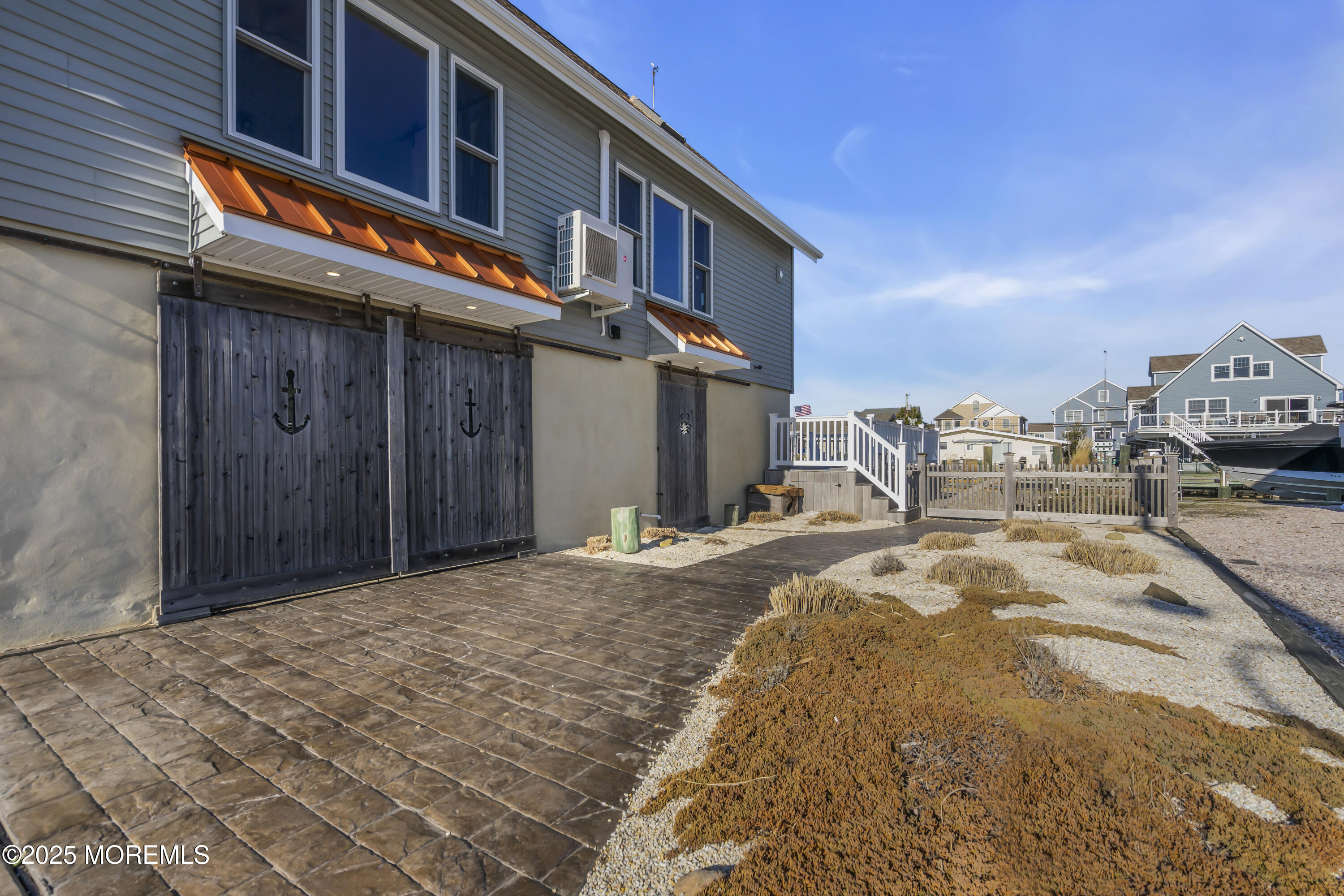 132 St Lawrence Boulevard Brick, NJ 08723 - Photo 43 of 55 a front view of a building with a cars park side of road