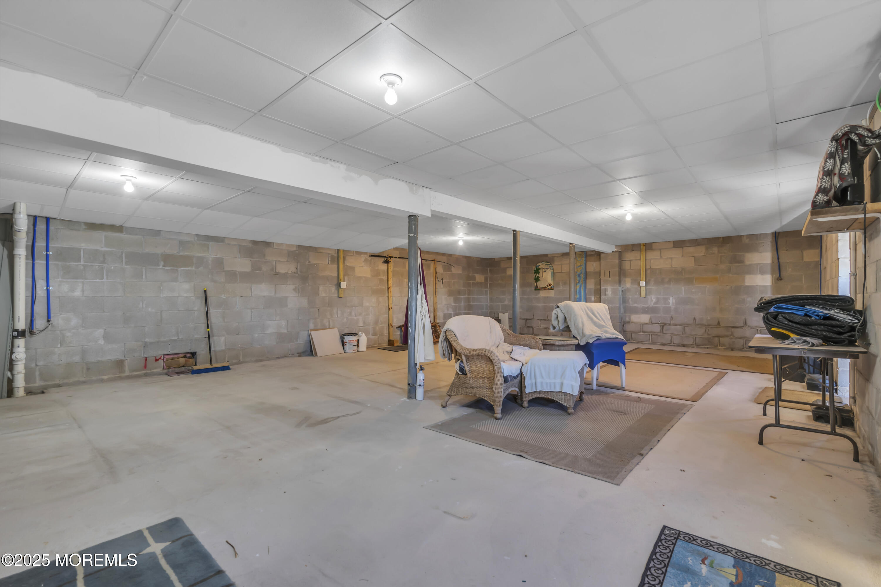 132 St Lawrence Boulevard Brick, NJ 08723 - Photo 45 of 55 a living room with lots of furniture and a chandelier