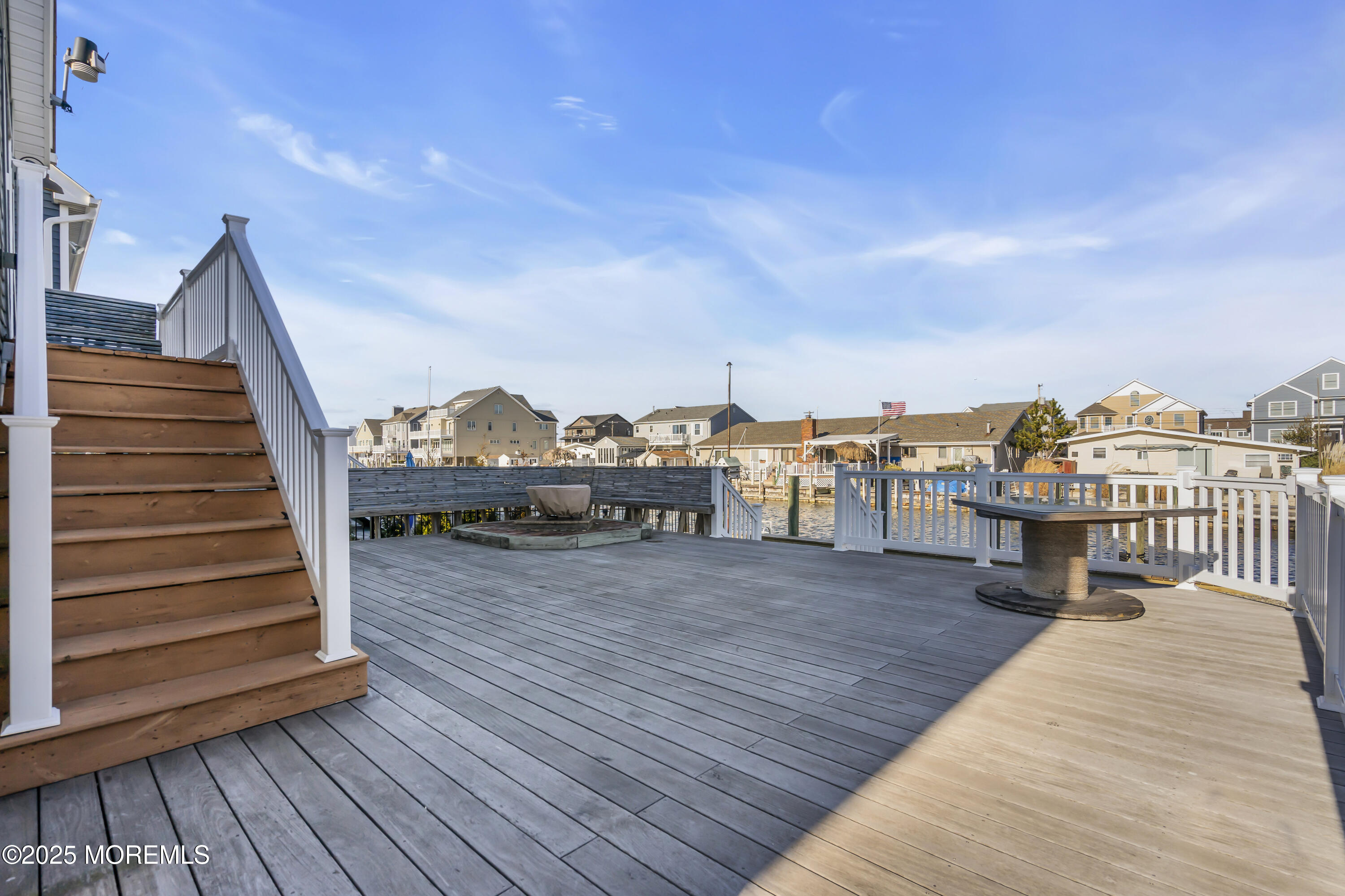 132 St Lawrence Boulevard Brick, NJ 08723 - Photo 46 of 55 a view of a balcony with wooden floor and fence and city view