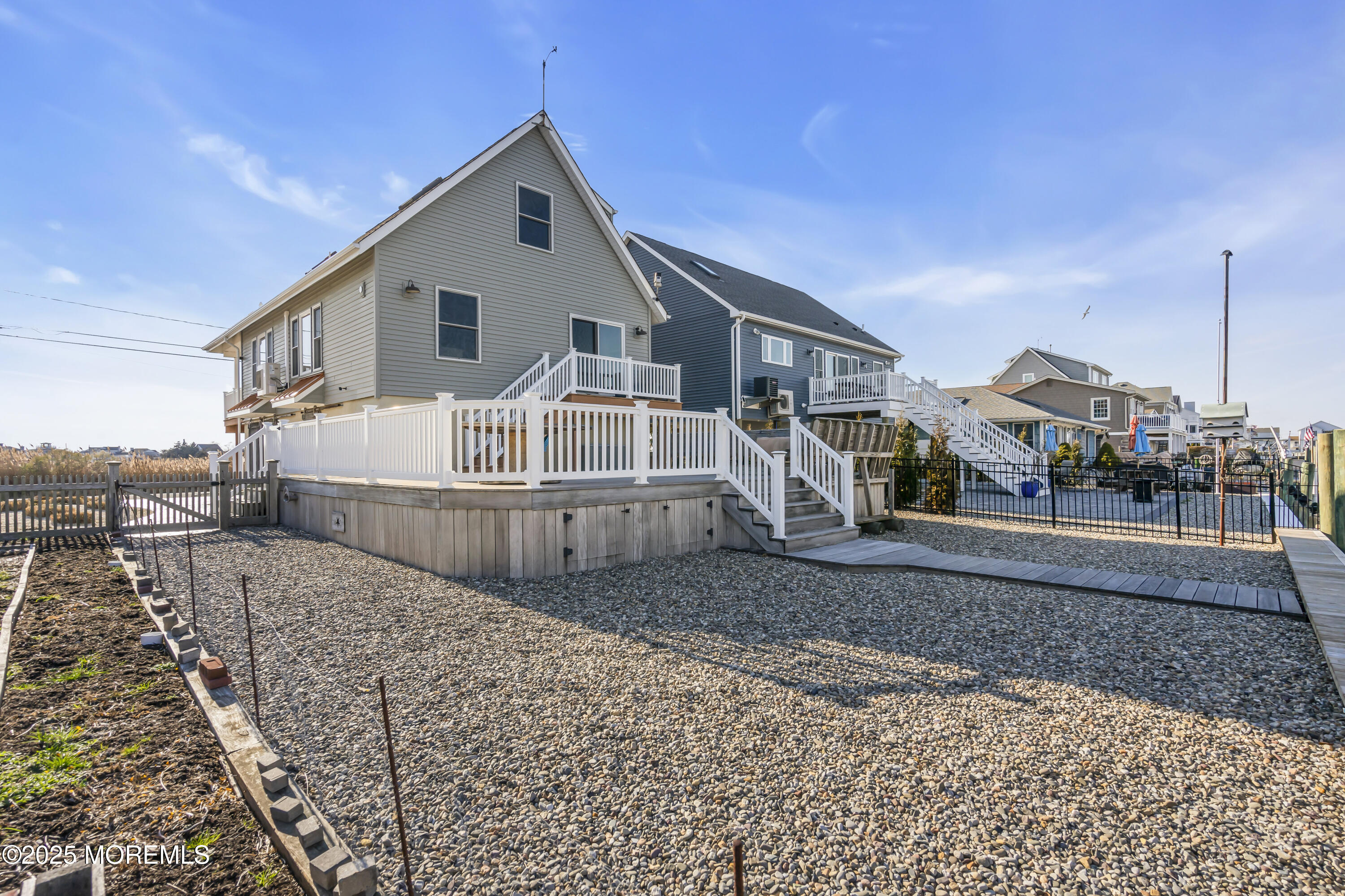 132 St Lawrence Boulevard Brick, NJ 08723 - Photo 53 of 55 a view of a white house with a yard
