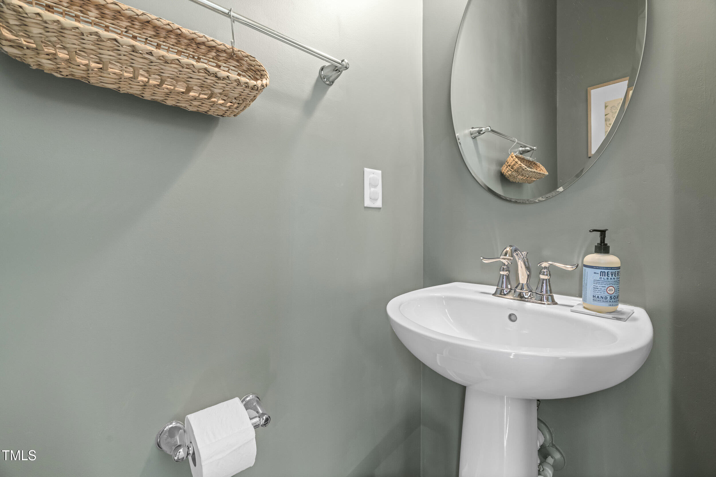 6607 Pathfinder Way Raleigh, NC 27616 - Photo 18 of 38 a bathroom with a sink and a mirror