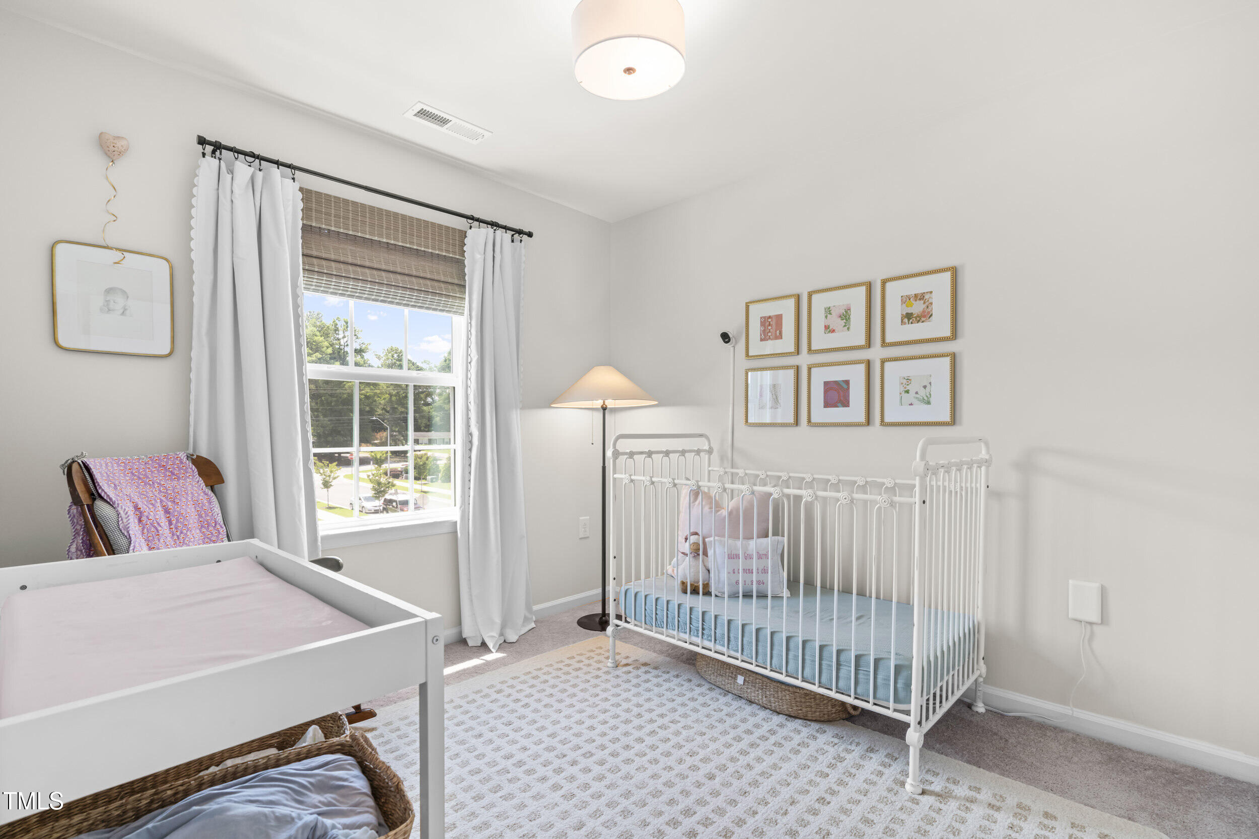 6607 Pathfinder Way Raleigh, NC 27616 - Photo 26 of 38 a bedroom with a bed and a window