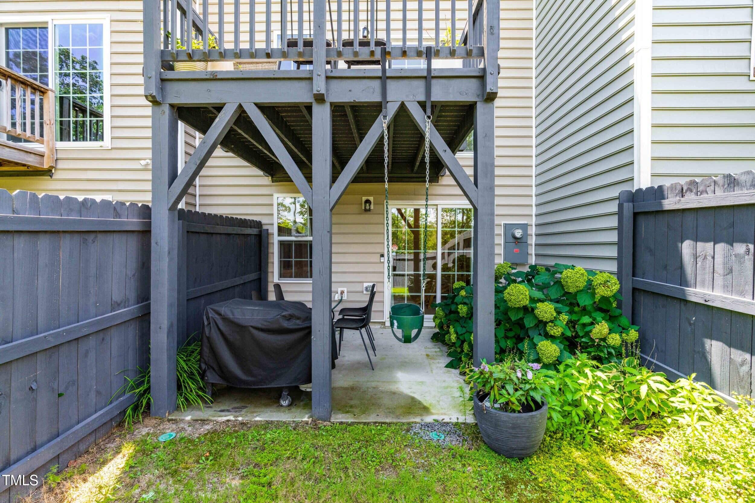 6607 Pathfinder Way Raleigh, NC 27616 - Photo 29 of 38 a view of a chair and table in backyard of the house