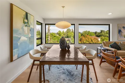 a view of a dining room with furniture window and outside view