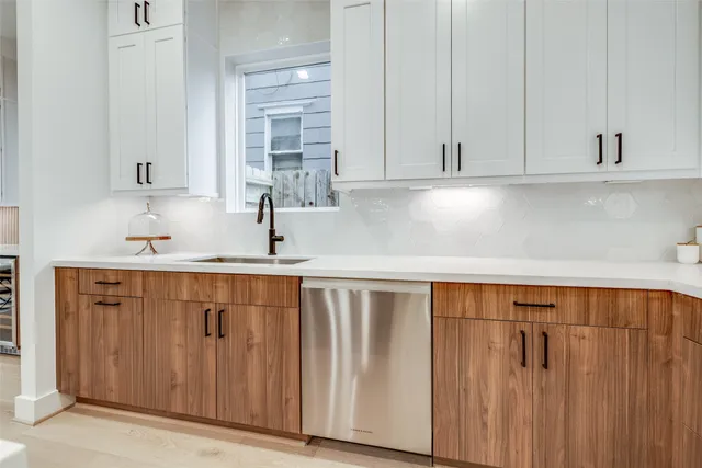 a kitchen with stainless steel appliances granite countertop a sink and cabinets