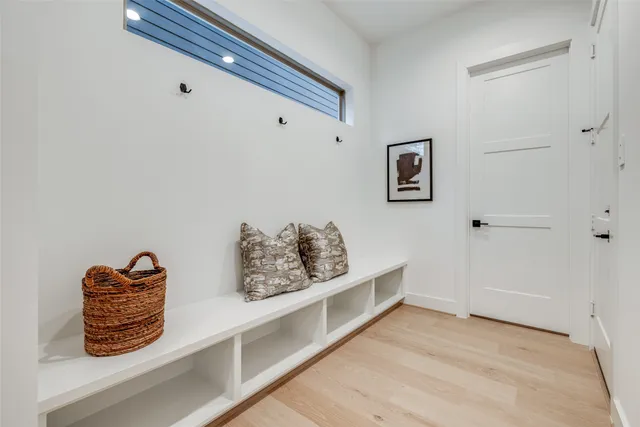 a view of livingroom with lounge chair and cabinet