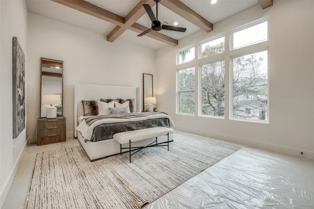 a bathroom with a double vanity sink a toilet a mirror and shower