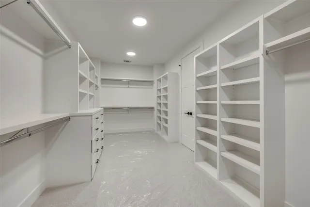 a view of an empty walk in closet