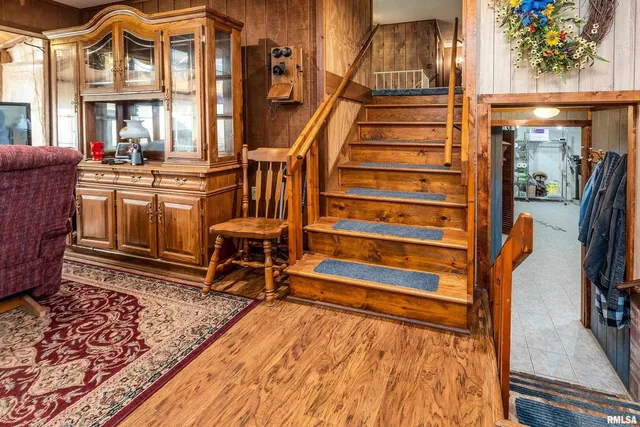a dining room with furniture and wooden floor