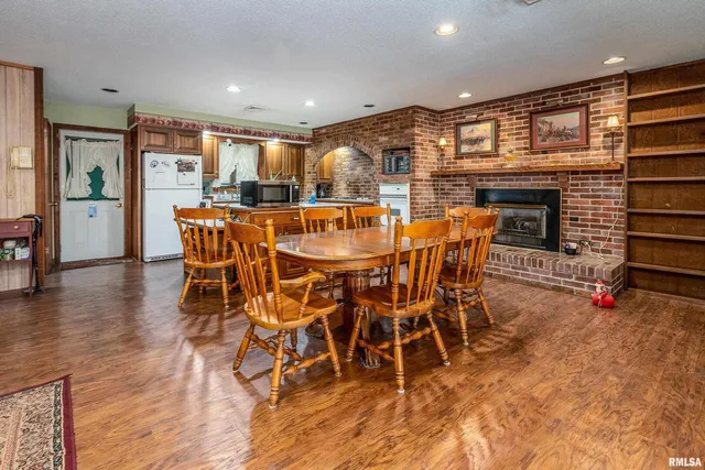 a living room with furniture oven and a fireplace