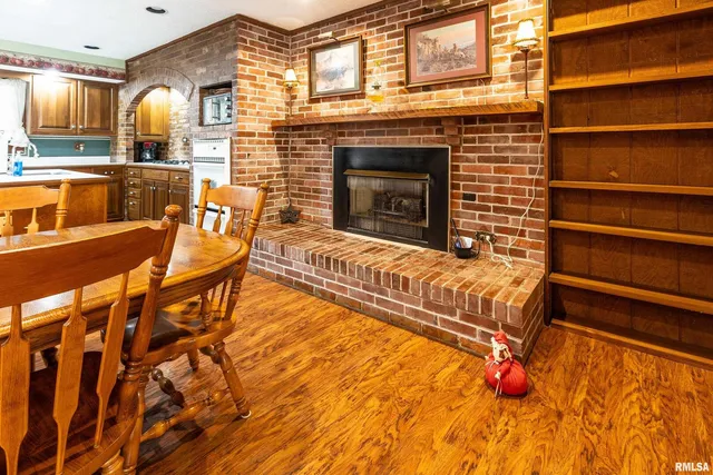 a view of a kitchen with a sink and wooden cabinets