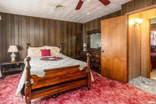 a bathroom with a sink a mirror and a shower
