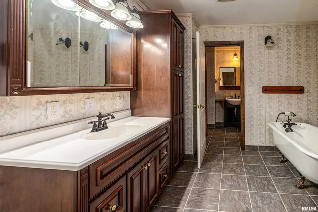 a bathroom with a sink toilet and mirror