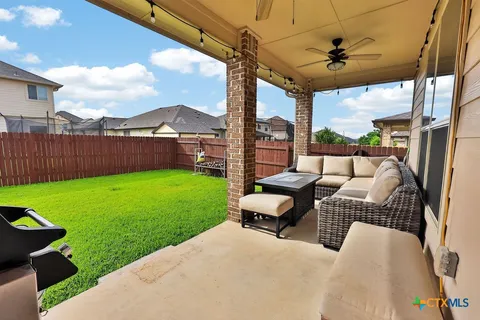 a view of a patio with a yard