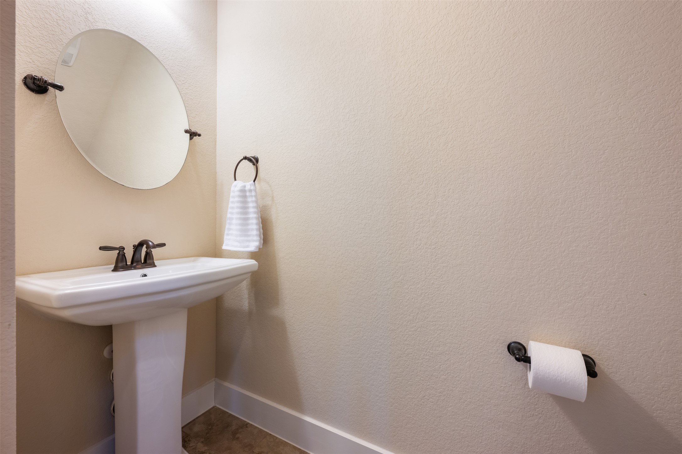 7615 Wolverine Street Austin, TX 78757 - Photo 24 of 40 a bathroom with a sink and a mirror