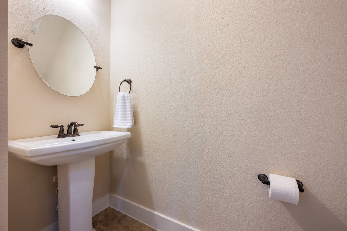 7615 Wolverine Street Austin, TX 78757 - Photo 24 of 40 a bathroom with a sink and a mirror
