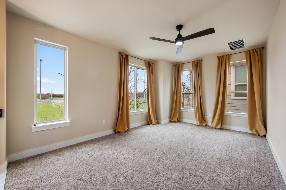 7615 Wolverine Street Austin, TX 78757 - Photo 25 of 40 a view of room with window and ceiling fan