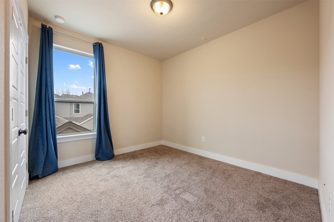 7615 Wolverine Street Austin, TX 78757 - Photo 29 of 40 an empty room with an entrance and door