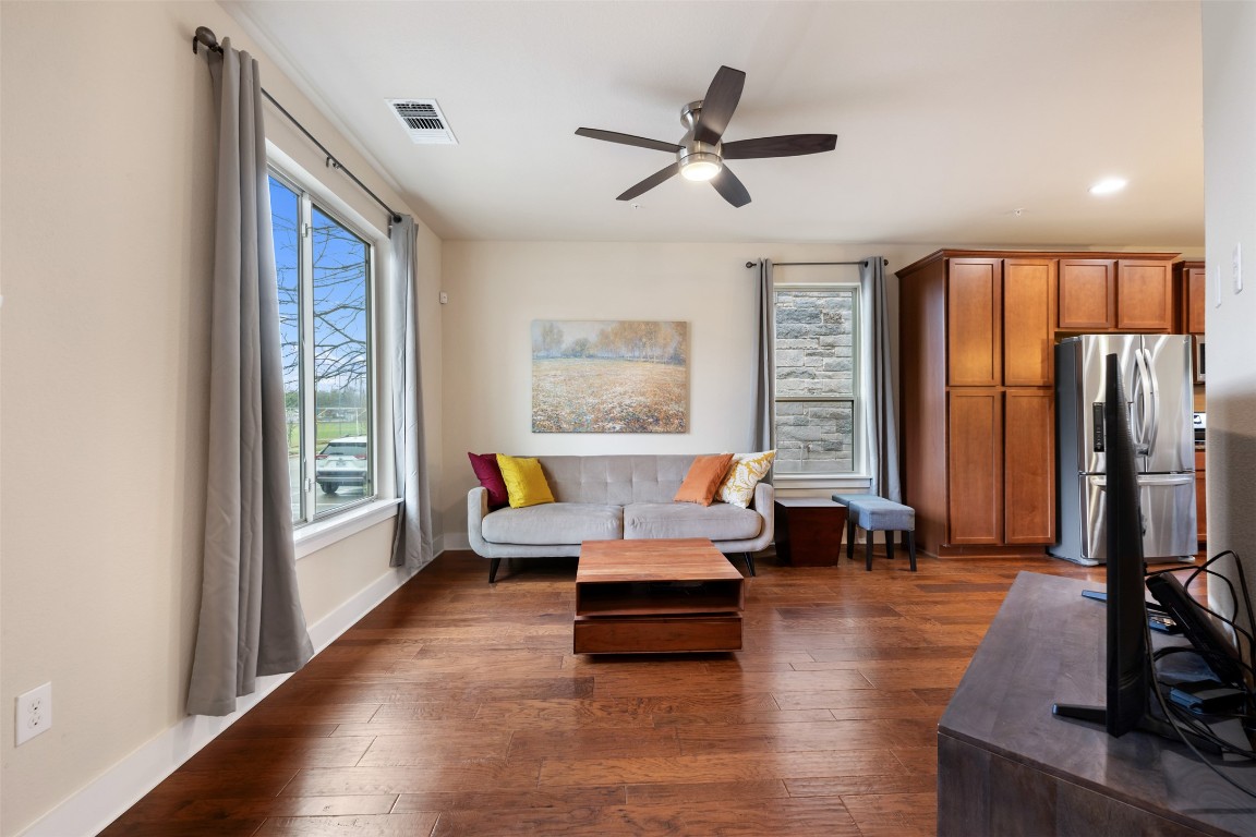 7615 Wolverine Street Austin, TX 78757 - Photo 6 of 40 a living room with furniture large window and a wooden floor