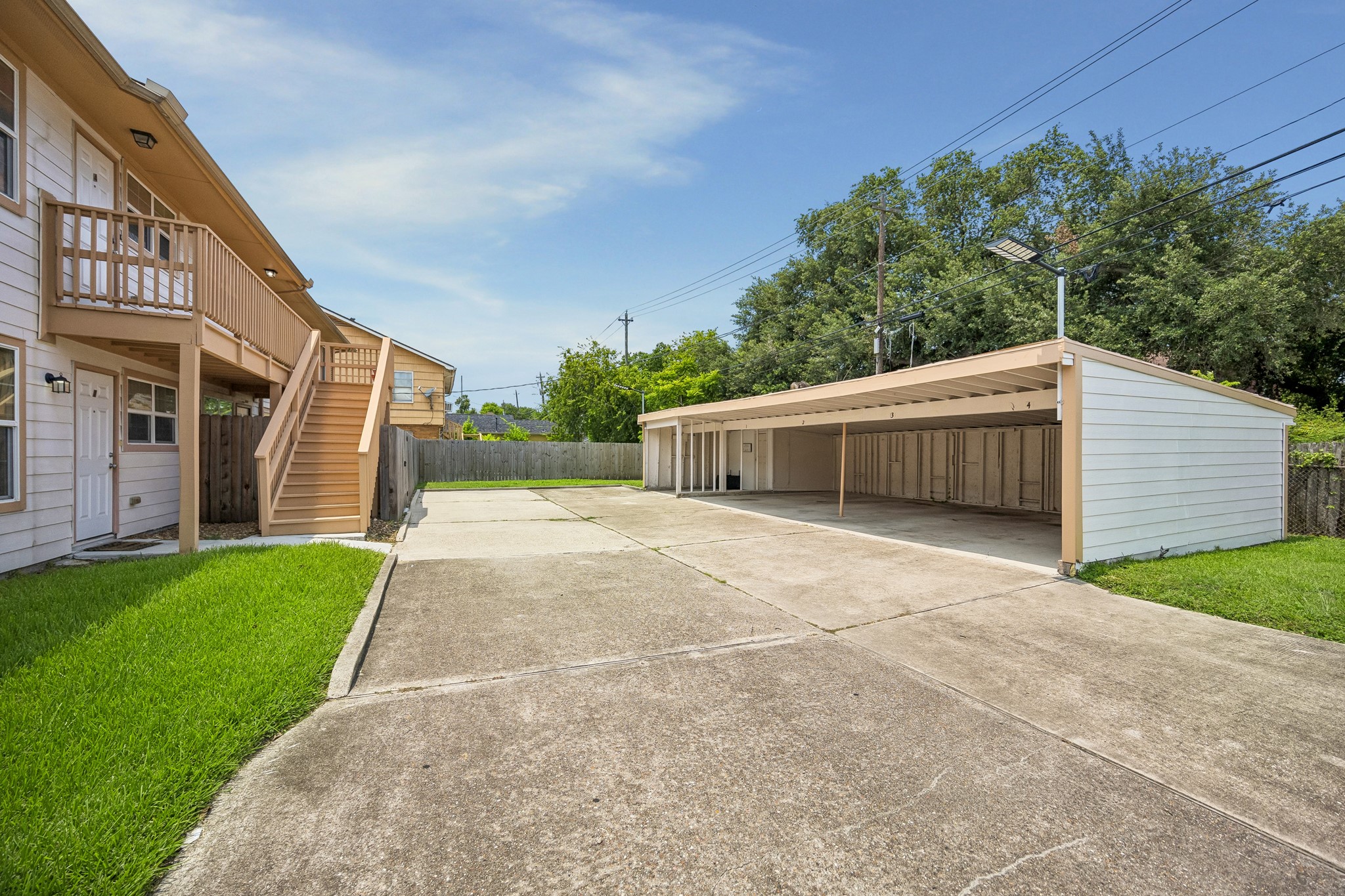 3237 Rosedale Street, Unit 2 Houston, TX 77004 - Photo 15 of 18 Covered parking with additional laundry room on-site